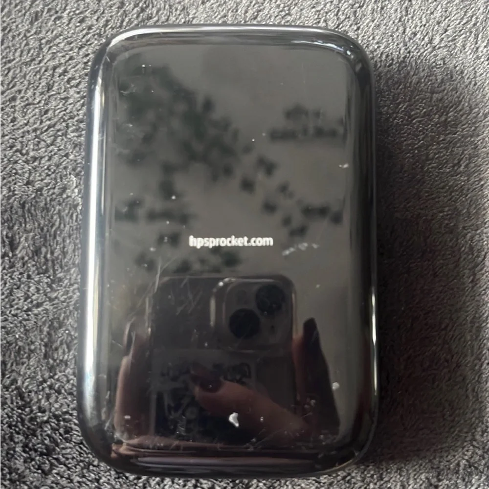 hp sprocket, comes with a few pieces of sticker paper, mini printer, no charger